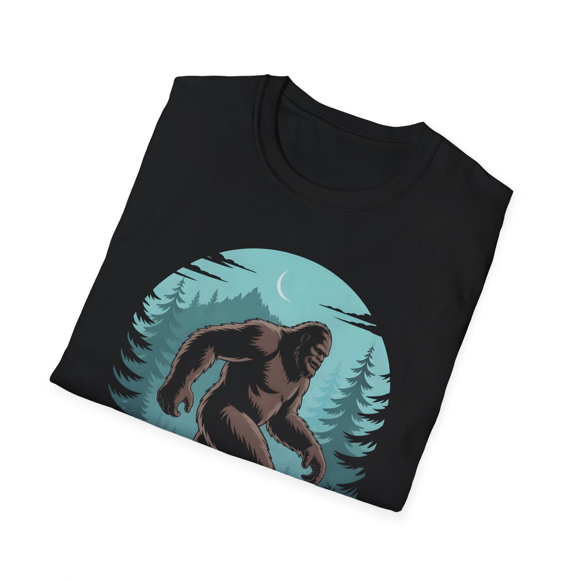 Folded black Eugene Oregon Bigfoot Tshirt showing a detailed Bigfoot illustration walking through evergreen trees at night in a circular forest scene.