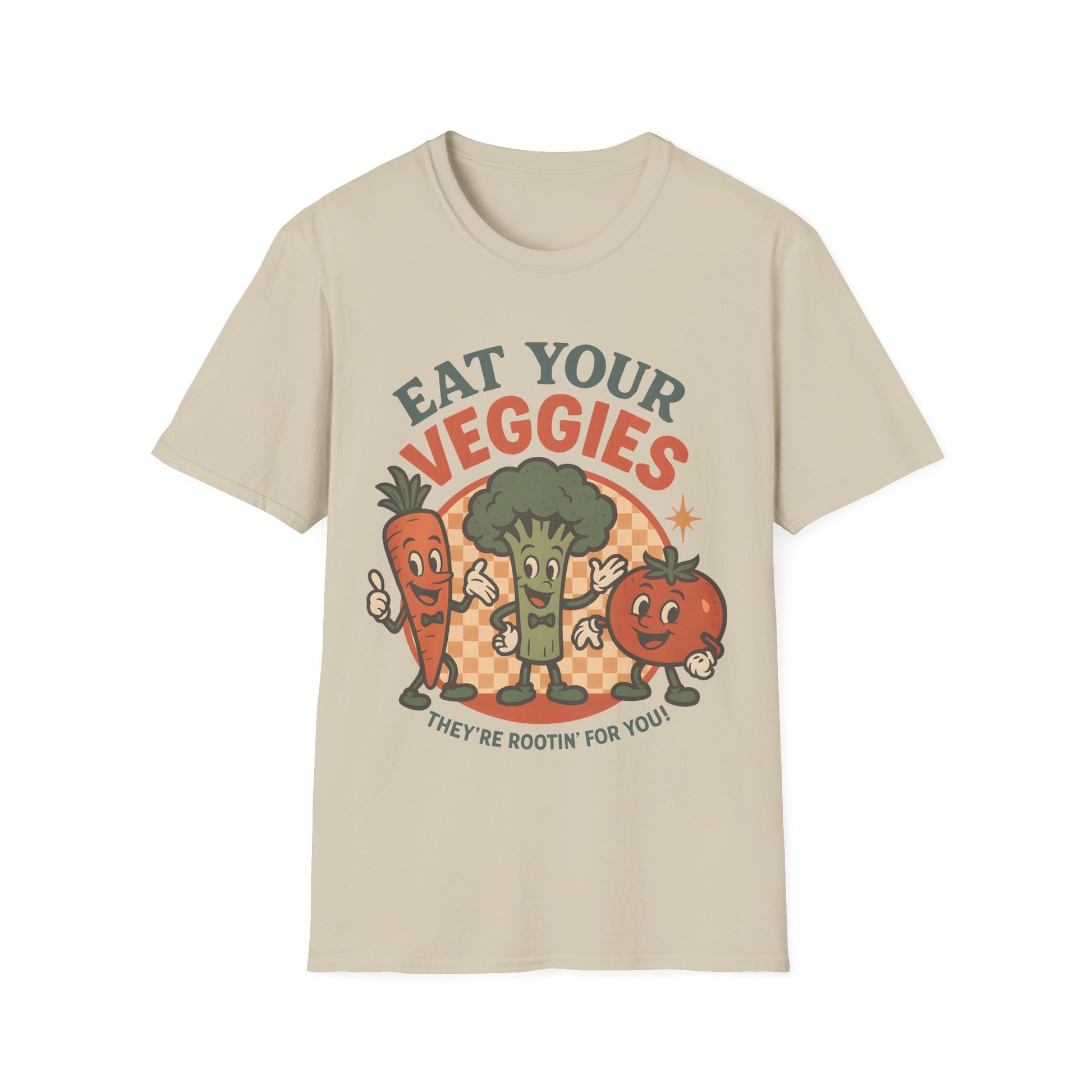 Flat lay of sand colored “Eat Your Veggies” vegan vegetable t-shirt, with cartoon carrot, broccoli and tomato characters and the slogan “They’re rootin’ for you!” on the front.