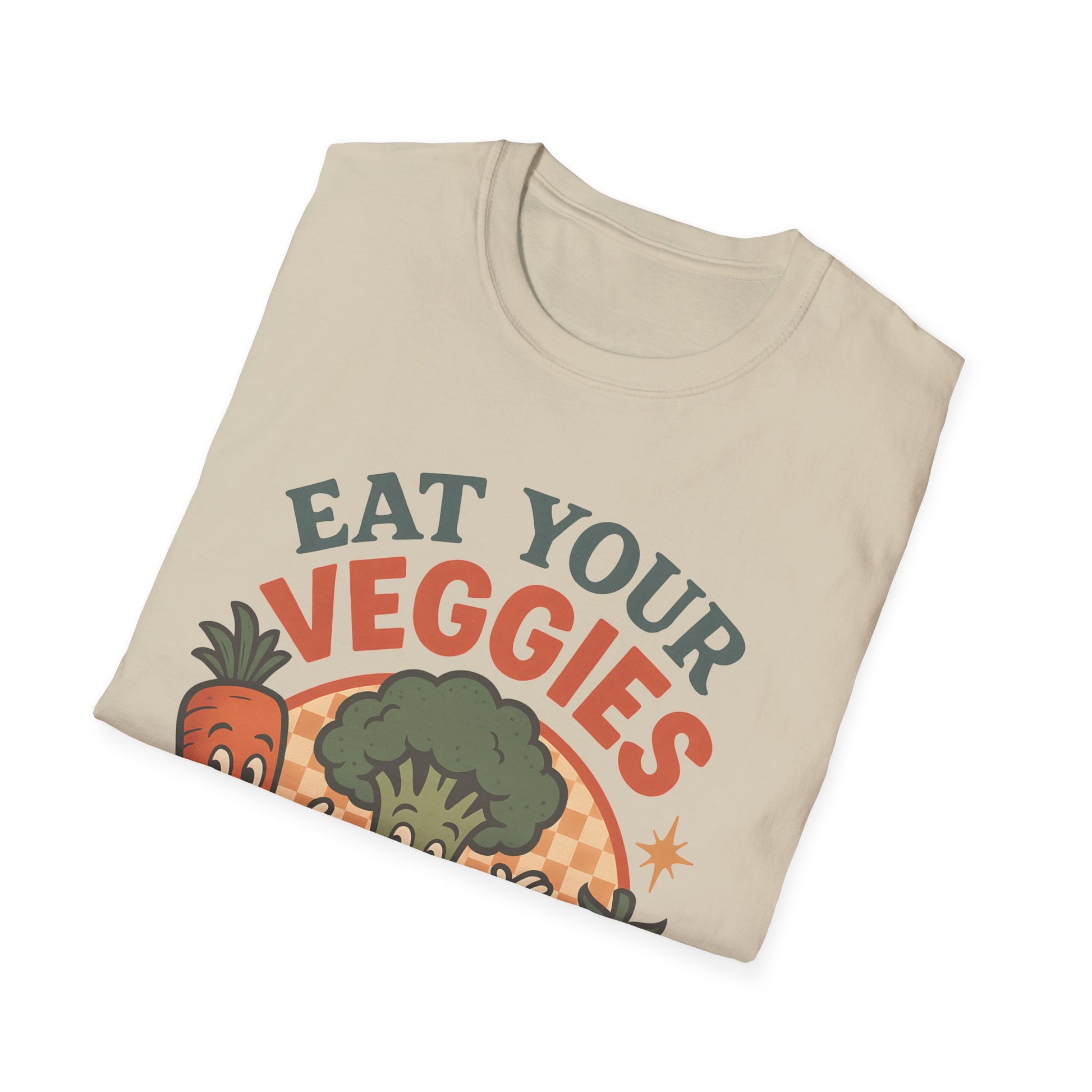 Folded cream “Eat Your Veggies” Vegan Vegetarian Veggie Vegetable Tshirt on a white background, close-up of bold carrot, broccoli and tomato artwork around the slogan.