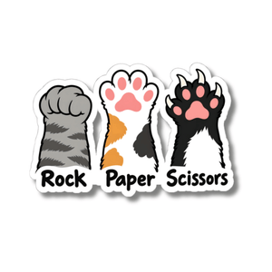 A kiss-cut sticker featuring three illustrated cat paw prints labeled 'Rock', 'Paper', and 'Scissors' on a white background.