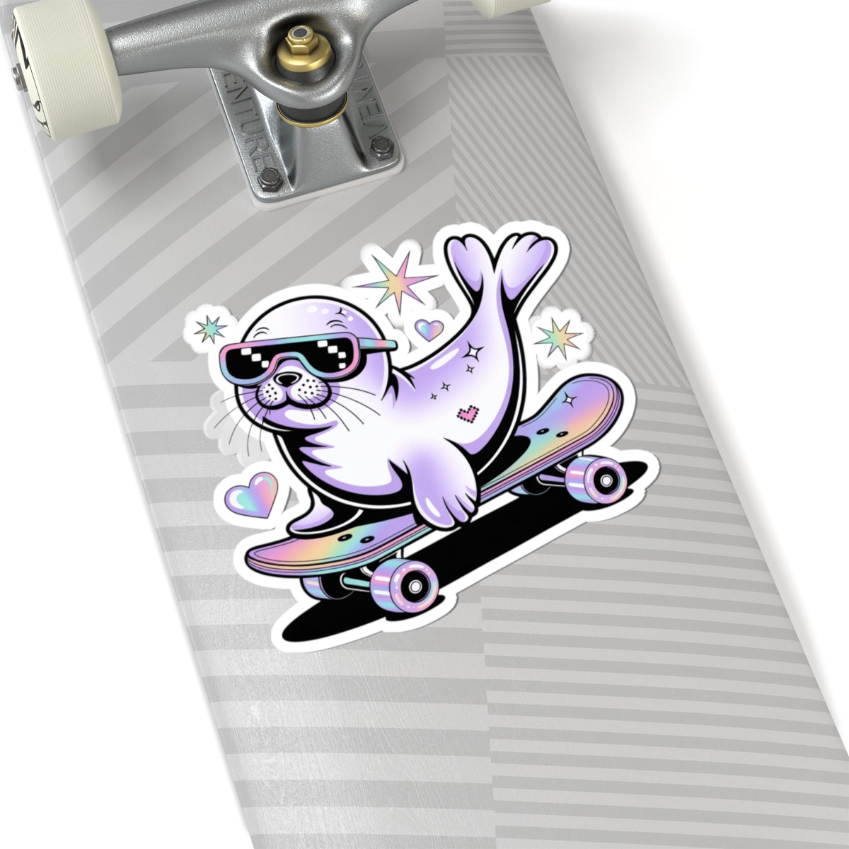 A kiss-cut vinyl sticker of a cartoon seal riding a skateboard, displayed on a gray striped skateboard deck.