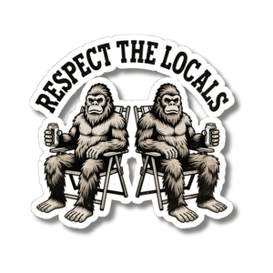 A kiss-cut sticker featuring two illustrated Bigfoot figures sitting in folding chairs and holding beer mugs, with the text 'RESPECT THE LOCALS' arched above them on a white background.
