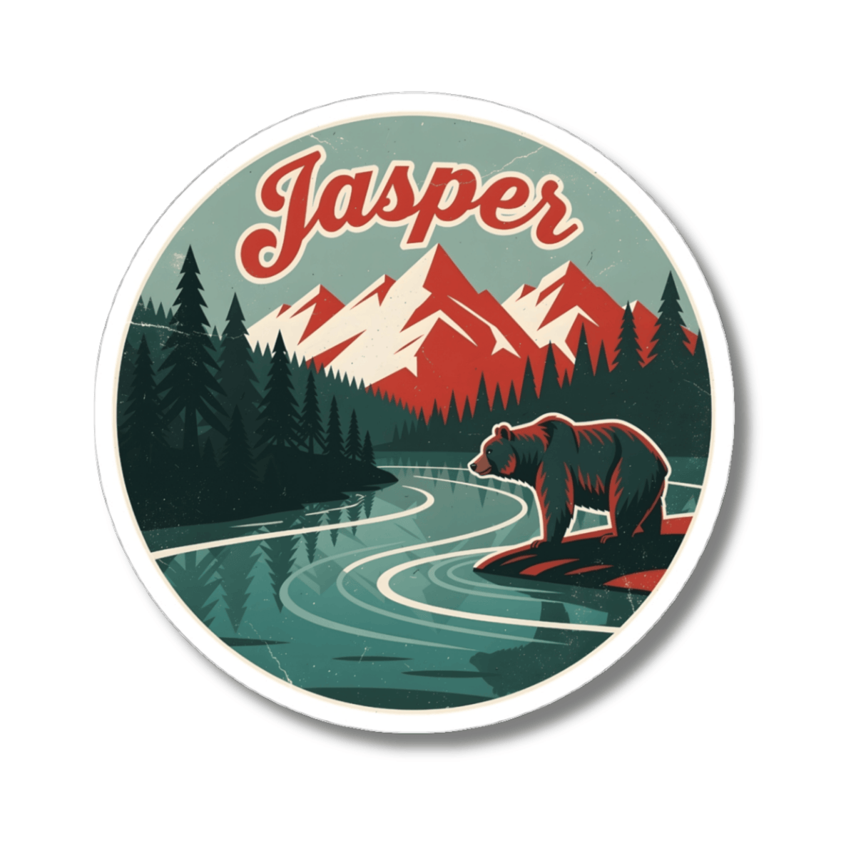 A circular sticker featuring a retro-style illustrated mountain landscape with the word 'Jasper' in red script at the top. The design shows dark green pine trees, red and white mountains, a winding teal river, and a brown bear standing on a rock in the foreground.