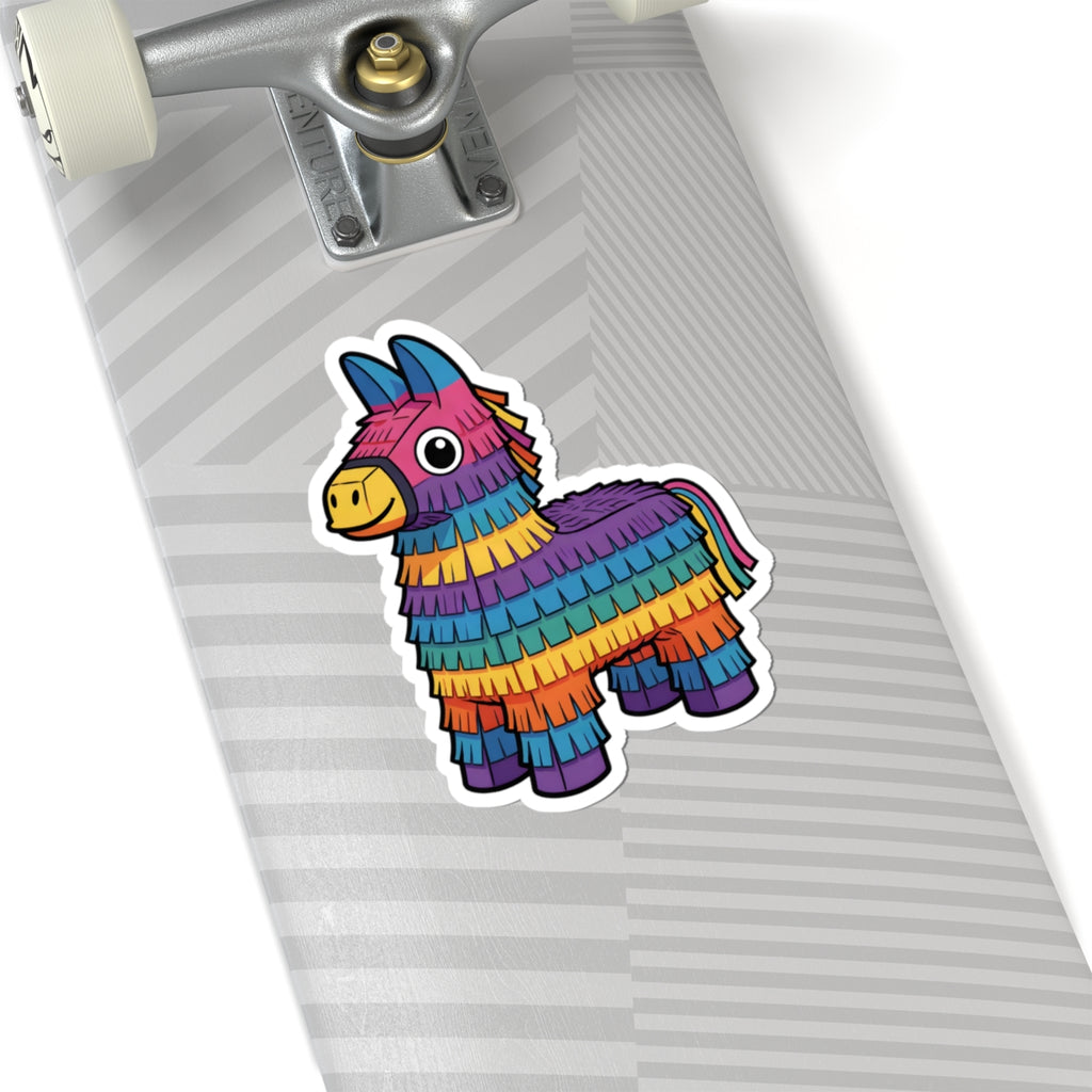 A colorful piñata donkey sticker applied to the deck of a skateboard, shown in a close-up angled view with the truck and wheels visible.