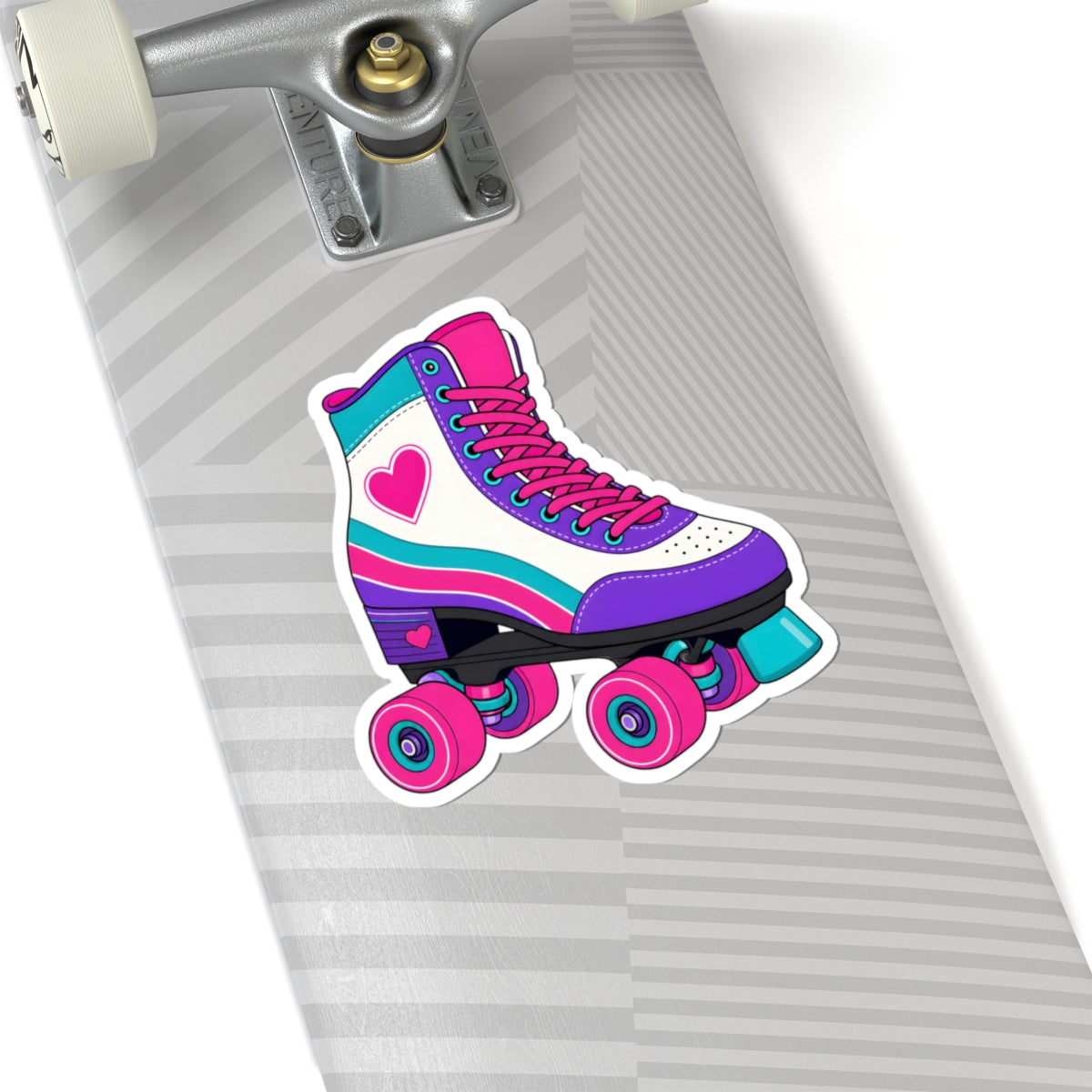 A kiss-cut vinyl sticker of a retro roller skate with pink, purple, and teal stripes, placed on the gray striped deck of a skateboard.