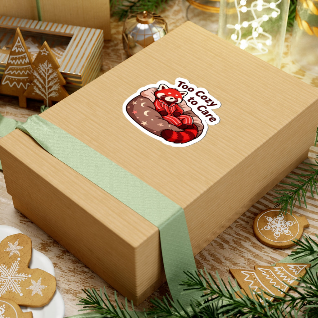 Wooden gift box with a red panda sticker on a festive table with cookies and lights.