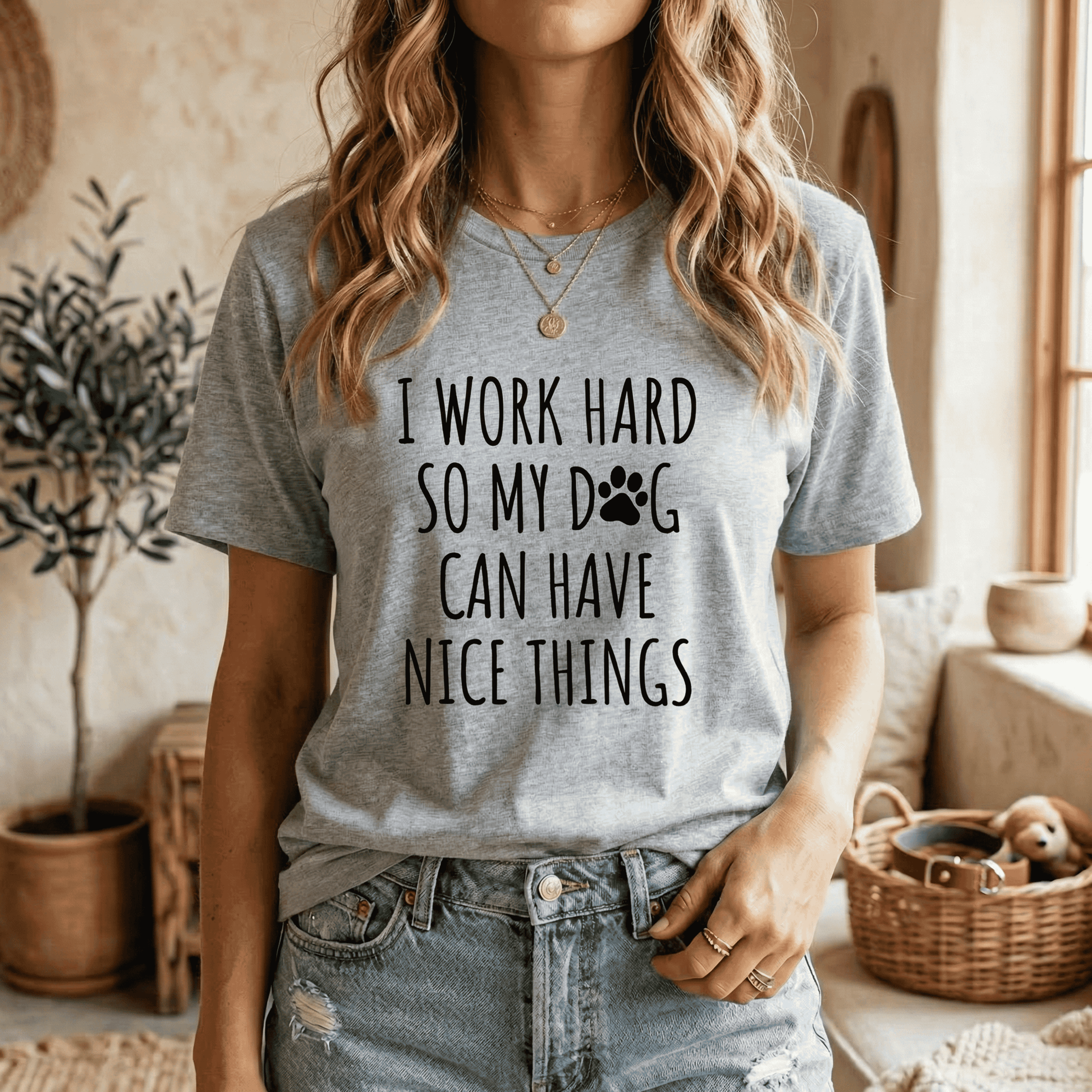 Athletic heather grey graphic tee modeled with a tucked-in style, showing the black text design "I Work Hard So My Dog Can Have Nice Things," a cozy and casual Dog Lover T-Shirt.