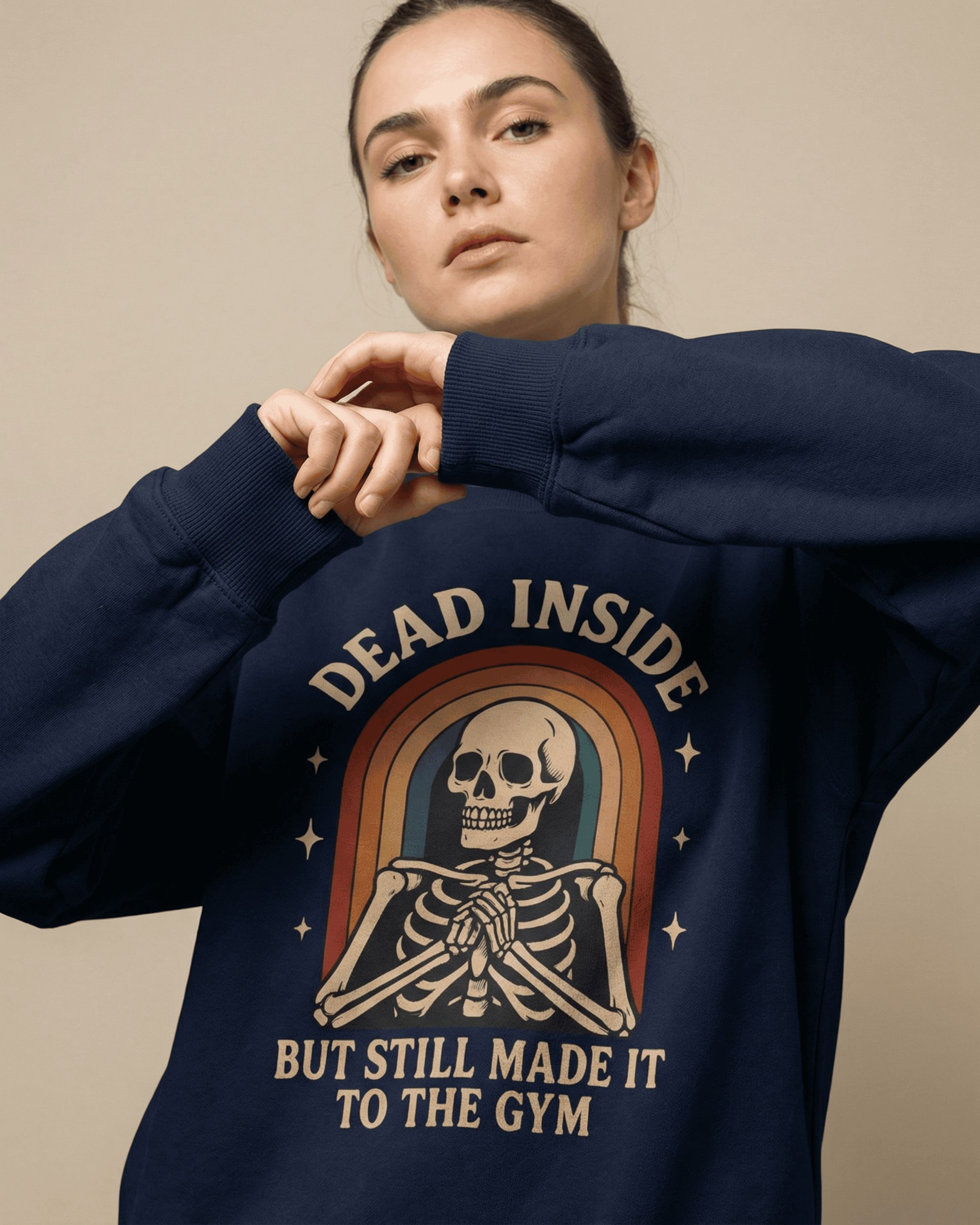 A woman models the navy Rainbow Skeleton Dead Inside Pullover against a neutral background. The close-up highlights the comfortable fit and the detailed graphic of the Funny Retro Gym Sweatshirt.